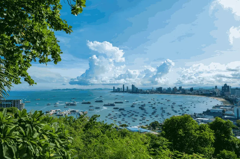 Pattaya Bay from the hill: boats, the beach and the city's towers